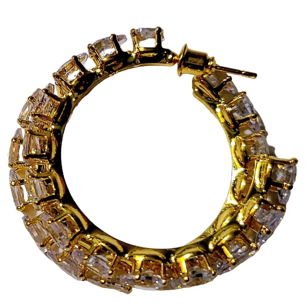 Elegant gold hoop earrings featuring dazzling zircon stones